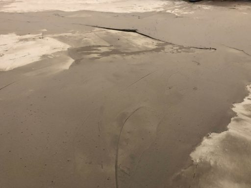 Concrete resurfacing underlayment 